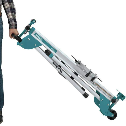 Man holding folded Compact Folding Miter Saw Stand with lightweight aluminum tubular frame, large wheels, and side handle.