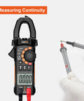 True RMS 6000 Counts Digital Clamp Meter Multimeter displaying continuity test with probes, HD screen, portable design.