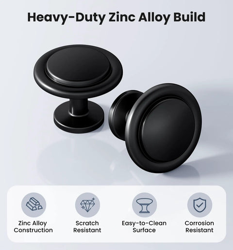 Matte Black Round Euro Style Cabinet Knobs One And One Quarter Inch 30 Pack, zinc alloy round knobs shown front and side