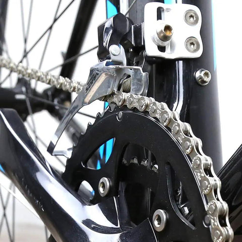 Close-up of 6/7/8 Speed Bike Chain One Half By Three Thirty Second Inch on a bike's drivetrain, showing 116 links with quick link.