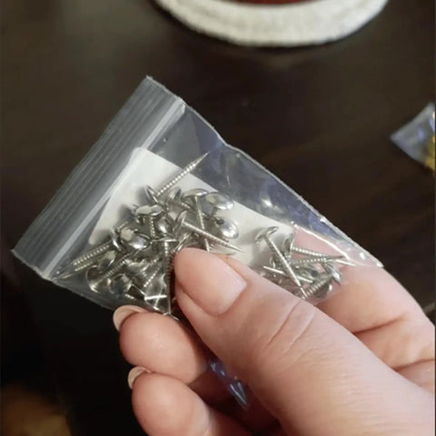 Kick Your Home Decor Up A Notch With These Legit Tough Vintage Silver Upholstery Nails 100 Piece Zinc Alloy Furniture Tacks in hand.