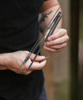 Person holding Two Piece Heavy Duty Steel Folding Umbrella Repair Kit Eight Bone Replacement Parts for swift fixes.
