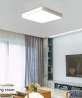 Square LED Flush Mount Ceiling Light 15.7 Inch 36W Modern Ceiling Lamp With Cool White 6500K Ideal For Living Room Kitchen Bedroom Dining Room White Finish Anti Glare Long Lasting Iron Frame installed in a modern living room.