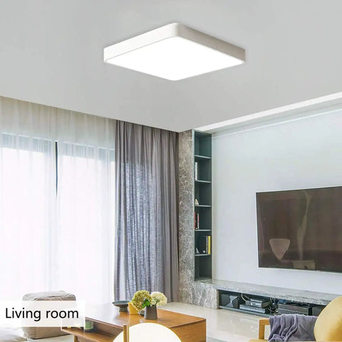 Square LED Flush Mount Ceiling Light 15.7 Inch 36W Modern Ceiling Lamp With Cool White 6500K Ideal For Living Room Kitchen Bedroom Dining Room White Finish Anti Glare Long Lasting Iron Frame installed in a modern living room.