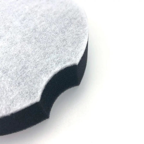 Close-up of the edge of a black and white filter, part of Two Pack Filter Replacement Compatible With Bissell PowerForce Compact Upright 2112 1520.