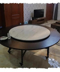 Massive Wooden Lazy Susan Turntable 50 Inch Round Rotating Serving Tray For Dining Table And Kitchen Counter in modern home setting.