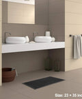 Heavy Duty Commercial Rubber Floor Mat Featuring Hexagonal Drainage Cutouts For Garage And Shop Kick Ass Non Slip Oil Grease Resistant Tough As Nails Level, 23x35 inches, in a modern bathroom setting.