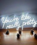 You Are So Pretty Neon Sign Led Light Up Wall Decor Made From Transparent Acrylic For Indoor Use In Living Room Bedroom Office Party Wedding Christmas Gift 29.9 By 13.7 Inches Cool White glowing on wall.