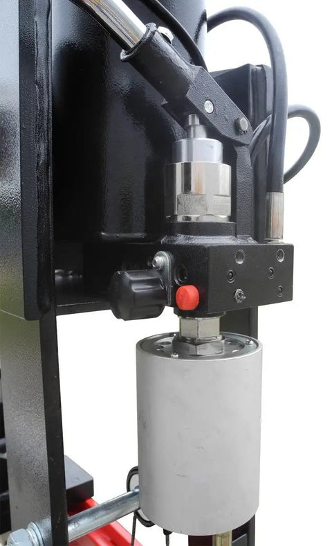 Close-up of the cylinder and pressure control on Heavy Hitting 75 Ton Air Hydraulic Shop Press With Precise Pressure Gauge.