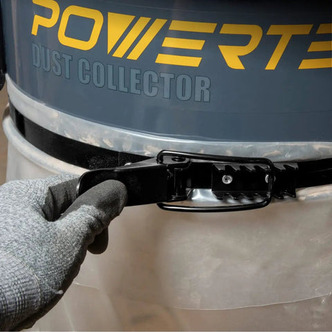Pro Grade 19 1/8 Inch Band Clamp For Dust Collector sealing a dust bag on a collector with a gloved hand.