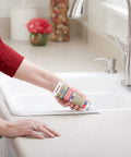 Advanced Silicone Kitchen And Bath Sealant In Almond Color For Easy DIY No Mess Caulking In Kitchens And Bathrooms Two Point Eight Ounce Tube Made In USA Durable Long Lasting Grout Line Edge Sealant used on a kitchen sink countertop.