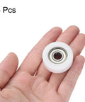 Eight Piece 608ZZ Double Shielded Nylon Ball Bearing Roller in hand, showcasing 32mm white nylon design for drawer slides.