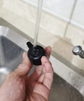 Person cleaning Steam Release Handle Valve For Foodi OP401 OP301 6.5 Qt And 8 Qt Series Replacement Pressure Cooker Part