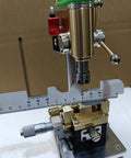 Joverex Multifunction Micro Watch Bench Drill Press With Adjustable Voltage And Variable Speed Up to 9500Rpm showing brass components and measuring tool.