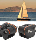 Beefy Quick Release Rope Cleat For Boats With Marine Grade Cam Cleat And Ball Bearing Action next to a sailing boat