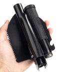 Hand holding Folding Survival Shovel For Camping And Trekking, All In One Entrenching Tool With Carry Pouch And Durable Metal Handle