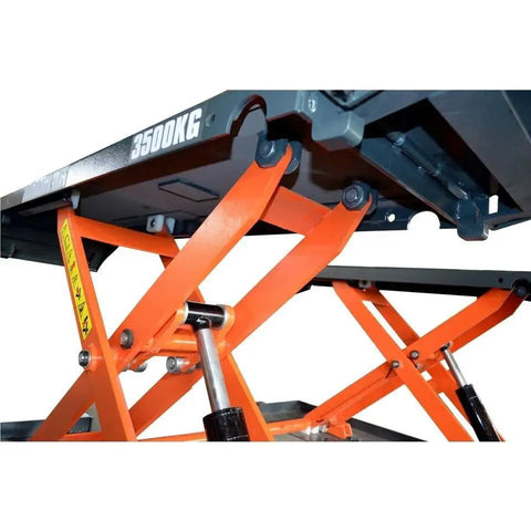 Smooth Operator Mobile Mid Rise Scissor Lift Featuring Electric Release And 8000 Pound Capacity showing hydraulic mechanism and lift arms.