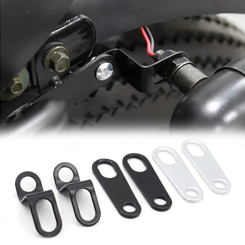 Six-piece rear turn signal relocation brackets set for motorcycles; black and silver metal plates