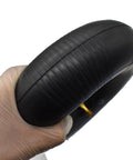 4 Pack Inner Tube For 4.10 3.50 4 Inch Tires With TR87 Bent Metal Valve Stem Heavy Duty held by gloved hand
