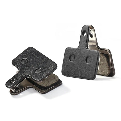 Fifteen Pair Top Shelf Bicycle Brake Pads Resin Compound Rotor Replacement For Hydraulic Disc Systems With Killer Grip Stopping Power And Ride Easy Durability, showing two brake pads from above.