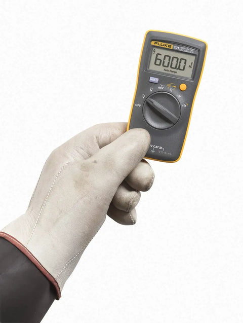 Person holding Compact Digital Multimeter With 0.5 Percent DC Accuracy, CAT III 600 V Safety, Diode And Continuity Test With Beeper