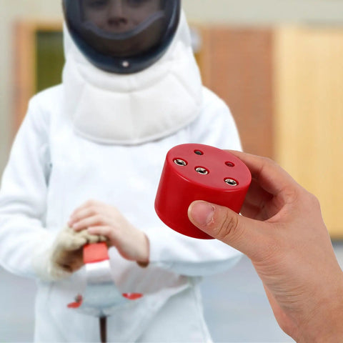 Person holding fencing gear tester box for foil and epee training and gear repair with beeping sensor in red.