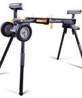 Lightweight Universal Miter Saw Stand With 330 Lb Capacity, A Real Workhorse, Easy Fold, Quick Release Mounting Brackets, Adjustable Extension From 37 Inches To 76.7 Inches, Fits Most Saws, Black And Grey, Model WK-MS050B in use.