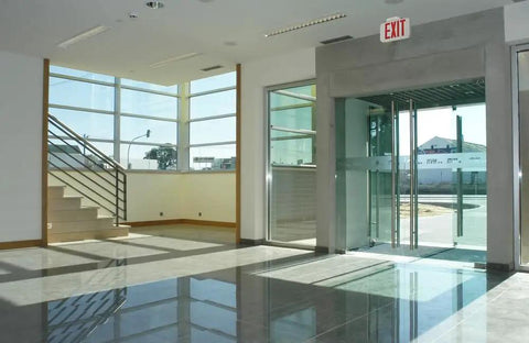 Interior view with Single-Sided LED Exit Sign With Thermoplastic Housing And Switchable Red Or Green, AC Powered, above door.