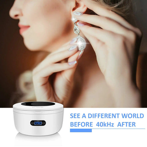 Woman wearing earrings near a Beast Pro-Grade Ultrasonic Jewelry Cleaner With 25-Ounce Tank for deep clean before 40kHz.