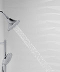 Forte Three Spray Settings Wall Mount Showerhead in Vibrant Brushed Bronze with water sprays on in a tiled bathroom.