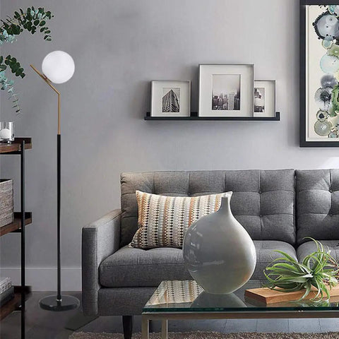 Mid Century Modern White Glass Ball Floor Lamp For Living Room Bedroom Office And Hotel, Tall 60 Inch Stand, shown beside a grey sofa