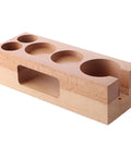 Rock Solid Fifty Eight Mm Espresso Tamping Station Made From Sturdy Natural Wood to organize barista tools with five slots.
