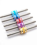 Colored mini 4WD hexagonal turnbuckles 4 to four point five millimeter self made parts for Tamiya pro tool use organized on a white surface