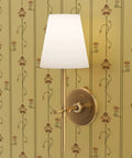 Top Tier Beige Floral Stripe Metallic Wallpaper With Glowing Gold Accents And Major Textured Fibrous Finish with wall lamp.