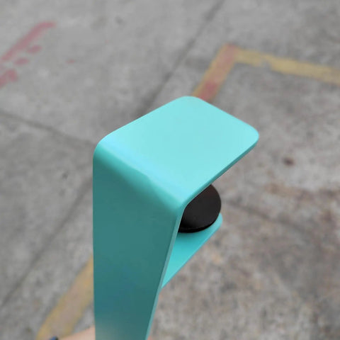 Close-up of clamp on adjustable iron table legs for DIY coffee and dining tables, modern design.