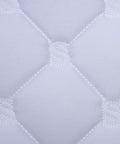 Close-up of quilt pattern on Quilted Contoured Dressage Pad With Braided Trim For Top Notch Horse Comfort And Smooth Arena Performance In White