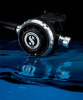 Mk19 Evo G260 Dive Regulator System For Scuba Diving With Air Balanced First Stage in black, silver detailing on blue water surface