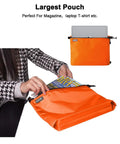 Large pouch from Three Pack Travel Toiletry Bags for Men Carry-On Organizer Pouch Set Zippered Cosmetic and Electronics Pouches Durable Nylon Ripstop Water-Repellent On-The-Go Portable Packing Cubes in Orange showing storage for magazines and laptop.