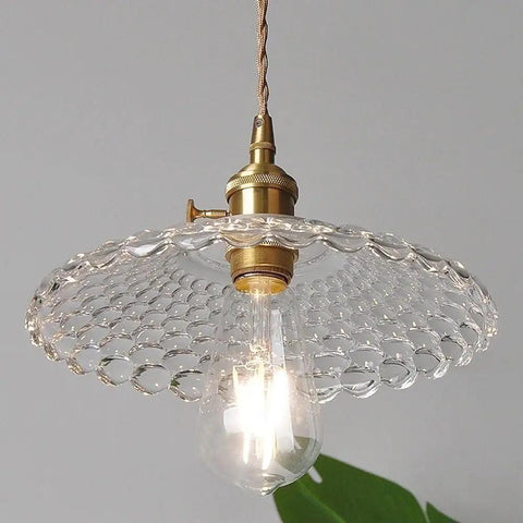 UIOLCFF Classic Creative Personality Nordic Minimalist Glass Shade Single-Head Hanging Light with clear glass and brass base.