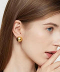 Half Ball Stud Earrings for Women, Gold Tone 20mm Round Ball Jewelry, Minimalist Yet Bold Everyday Earrings, Lightweight 3.2g, Gold Plated Stainless Steel, Lead Free, the Perfect Accessory That Goes With Any Fit. gold half-ball stud earring on model