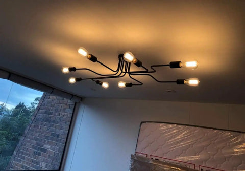 Black Sputnik Ceiling Light Fixture With Eight Adjustable Arms Industrial Semi Flush Mount Chandelier lit in living room