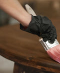 Person applying Ultimate No Fuss One Coat Durability Polyurethane Clear Wood Finish For All Interior Wood Surfaces on table edge