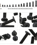 Close-up of black laptop screws showing various sizes in Slick Pro Level 880 Piece Laptop Screw Replacement Kit With Extra Phillips Driver.