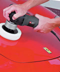 Powerful 4.5 Amp 6 Inch Orbital Sander And Polisher With Variable Speed 2,500 To 6,800 OPM in use on a red car surface