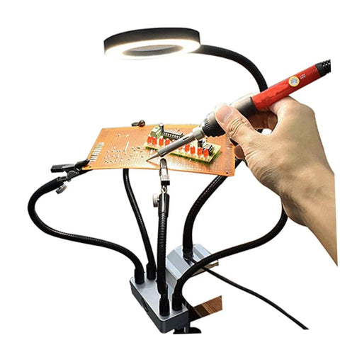 LED Magnifying Glass Table Lamp With Adjustable Brightness And Color Temperature For DIY Pro Grade Crafts Jewelry Making Welding Repair And Reading Hands Free Workbench Magnifier Light in use with soldering iron on circuit board
