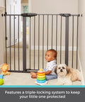 Extra Tall And Wide Pressure Mounted Baby Gate For Doorways, Adjustable 29.75 To 52 Inches Wide And 36 Inches Tall, Graphite Finish, Auto Close Door, Triple Lock System, Kid Safe, Durable, Great For Stairs, Hallways, And Open Spaces in hallway with child and dog