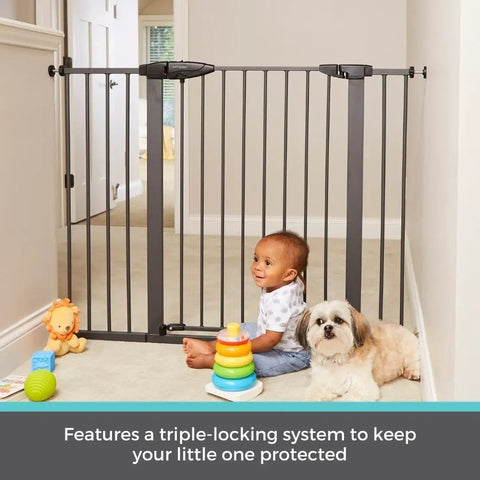 Extra Tall And Wide Pressure Mounted Baby Gate For Doorways, Adjustable 29.75 To 52 Inches Wide And 36 Inches Tall, Graphite Finish, Auto Close Door, Triple Lock System, Kid Safe, Durable, Great For Stairs, Hallways, And Open Spaces in hallway with child and dog