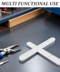 Eight Piece Adhesive No Fuss Drawer Slides For Baskets And Drawers Ten Inch ABS Plastic Rails on a workspace table.