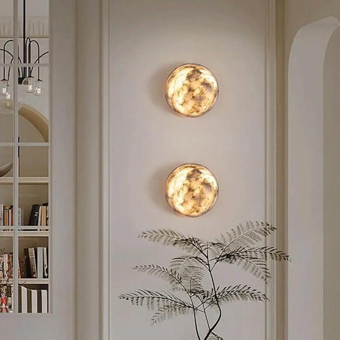 ROPCVAX Wall Sconce Lamp Light Fixture Lighting Modern Nordic, circular Alabaster wall sconces glowing on a wall.