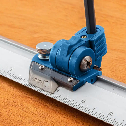 Close-up of the 9 Inch Quick Draw Marking Gauge For One Hand Operation With Spring Loaded Pencil Carriage And Dovetail Keyway on wood